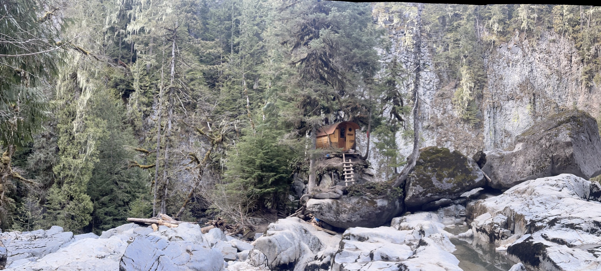 A sauna on a boulder in a river